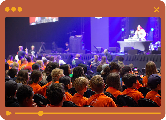 Students watching Truth and Reconciliation Week program on stage